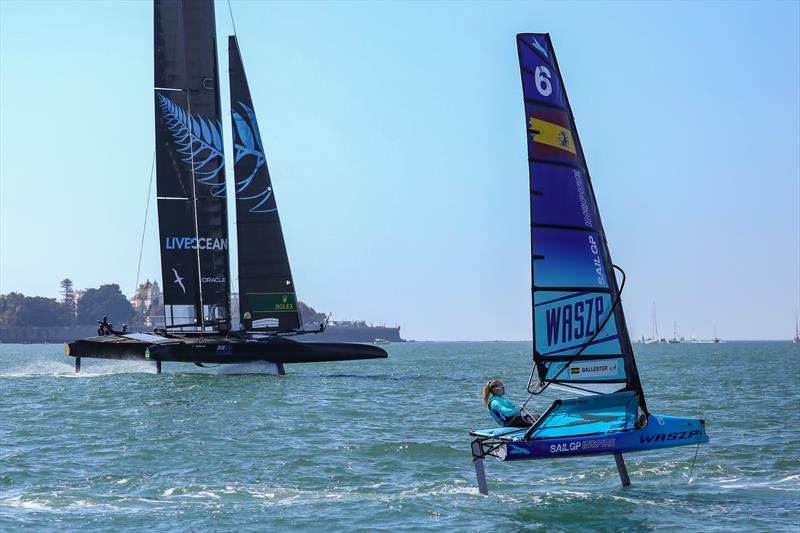 Young sailors sail past the New Zealand SailGP Team as they take part in the Inspire Racing x WASZP program. Spain SailGP, Event 6, Season 2 in Cadiz, Andalucia, Spain. 9th October photo copyright Felix Diemer/SailGP taken at  and featuring the F50 class