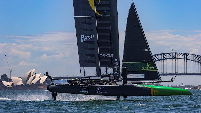 Australia SailGP Team helmed by Tom Slingsby sail past the Sydney Opera House and Sydney Harbour Bridge during a practice session ahead of Australia Sail Grand Prix presented by KPMG photo copyright David Gray for SailGP taken at  and featuring the F50 class