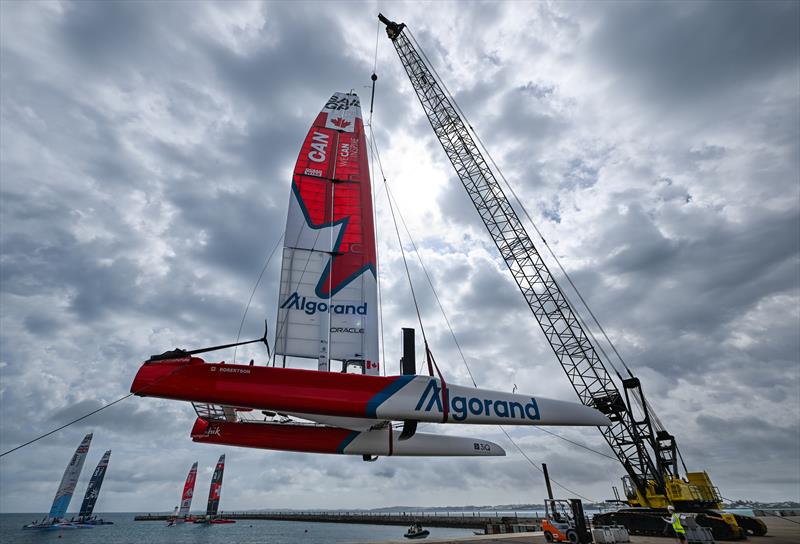 The Canada SailGP F50 catamaran is craned onto the water at the technical base prior to a practice session ahead of Bermuda SailGP  photo copyright Ricardo Pinto/SailGP taken at Royal Bermuda Yacht Club and featuring the F50 class