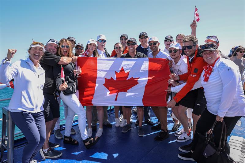 Supporters of the Canada SailGP Team hold the flag as they watch the action from the Adrenaline Lounge spectator boat on Race Day 1 of the T-Mobile United States Sail Grand Prix | Chicago at Navy Pier, Lake Michigan, Season 3 - photo © Katelyn Mulcahy for SailGP