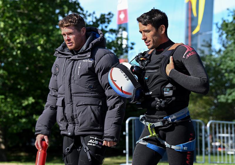 Quentin Delapierre, driver of France SailGP Team, speaks with Tom Slingsby, CEO and driver of Australia SailGP Team, as they arrive back at the Technical Base following the racing on Race Day 1 of the T-Mobile United States Sail Grand Prix  photo copyright Ricardo Pinto for SailGP taken at  and featuring the F50 class