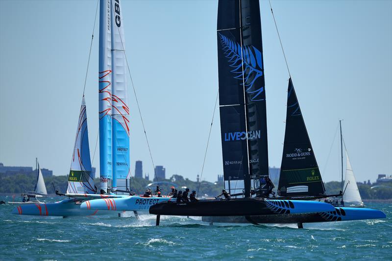 New Zealand SailGP Team co-helmed by Peter Burling and Blair Tuke and Great Britain SailGP team helmed by Ben Ainslie, in action on Race Day 1 of the T-Mobile United States Sail Grand Prix, June 2022 photo copyright Ricardo Pinto/SailGP taken at Chicago Yacht Club and featuring the F50 class