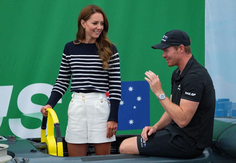 HRH The Duchess of Cambridge stands in the cockpit of the Australia SailGP Team F50 catamaran as she speaks with Tom Slingsby, CEO and driver of Australia SailGP Team, during a tour of the Technical Base at the Great Britain Sail Grand Prix | Plymouth - photo © Bob Martin for SailGP