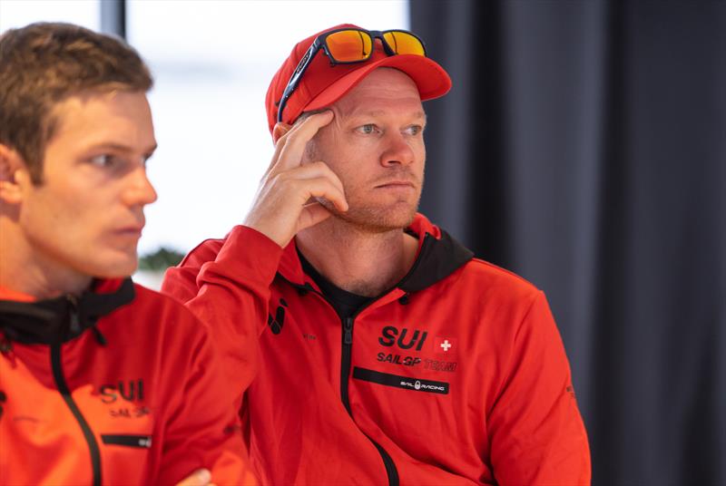 Nathan Outteridge currently with the Switzerland SailGP Team, listens to the skippers briefing prior to racing on Race Day 1 of the Great Britain Sail Grand Prix | Plymouth in Plymouth, England photo copyright Ricardo Pinto/SailGP taken at Royal Plymouth Corinthian Yacht Club and featuring the F50 class