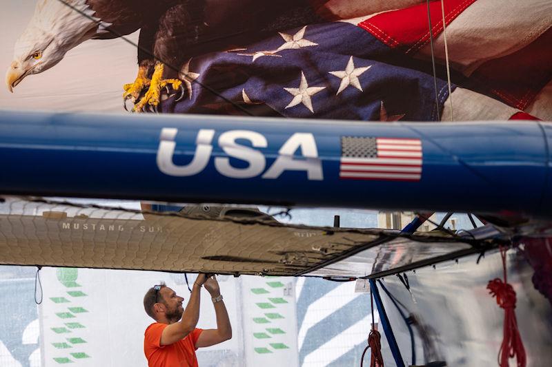A member of the SailGP Technical team prepares the USA SailGP Team F50 catamaran at the Technical Base ahead of the ROCKWOOL Denmark Sail Grand Prix in Copenhagen, Denmark photo copyright David Gray for SailGP taken at  and featuring the F50 class