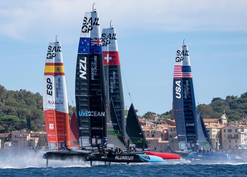 Spain SailGP Team , New Zealand SailGP Team , Switzerland SailGP Team and USA SailGP Team helmed by Jimmy Spithill sail past the bell tower and old town of Saint Tropez on Race Day 1 of the Range Rover France Sail Grand Prix in Saint Tropez,  - photo © Bob Martin/SailGP