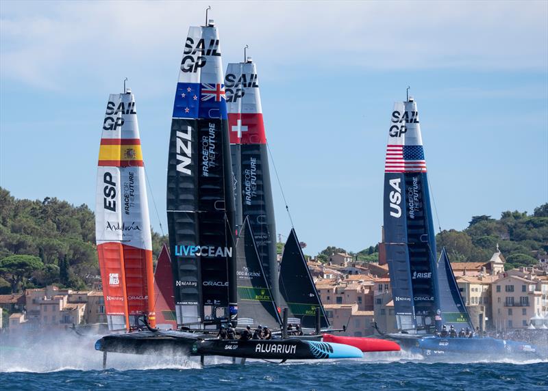 Spain SailGP Team , New Zealand SailGP Team , Switzerland SailGP Team and USA SailGP Team helmed by Jimmy Spithill sail past the bell tower and old town of Saint Tropez on Race Day 1 of the Range Rover France Sail Grand Prix in Saint Tropez,  photo copyright Bob Martin/SailGP taken at Société Nautique de Saint-Tropez and featuring the F50 class