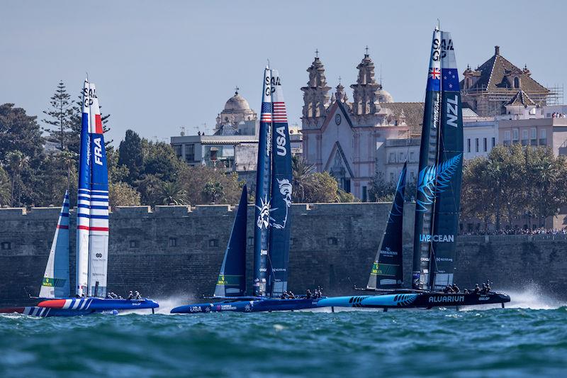 France SailGP Team helmed by Quentin Delapierre, USA SailGP Team helmed by Jimmy Spithill, and New Zealand SailGP Team helmed by Peter Burling sail past the Cadiz Cathedral on Race Day 1 of the Spain Sail Grand Prix in Cadiz, Andalusia, Spain - photo © Felix Diemer for SailGP