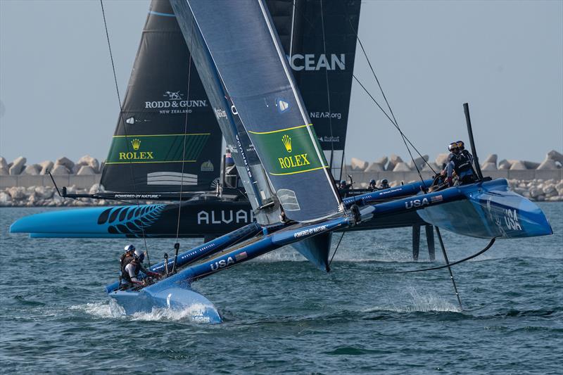 USA SailGP Team USA helmed by Jimmy Spithill sails past New Zealand SailGP Team helmed by Peter Burling during a practice session ahead of the Dubai Sail Grand Prix presented by P&O Marinas in Dubai, United Arab Emirates - photo © Bob Martin for SailGP