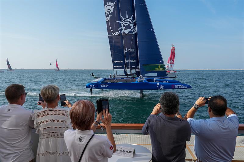 Guests enjoy the Adrenaline Lounge as USA SailGP Team helmed by Jimmy Spithill F50 catamaran foils past on Race Day 1 of the Dubai Sail Grand Prix presented by P&O Marinas in Dubai, United Arab Emirates - photo © Andrew Baker for SailGP