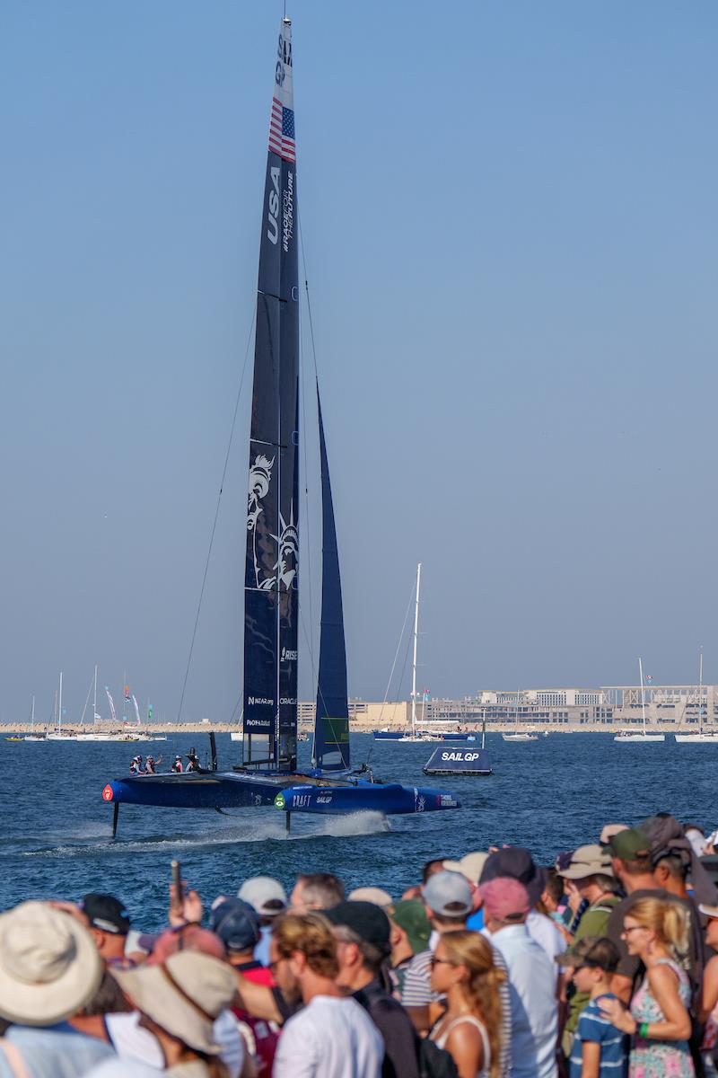 USA SailGP Team helmed by Jimmy Spithill in action as spectators watch on from the Race Village on Race Day 1 of the Dubai Sail Grand Prix presented by P&O Marinas in Dubai, United Arab Emirates photo copyright Joe Toth for SailGP taken at  and featuring the F50 class