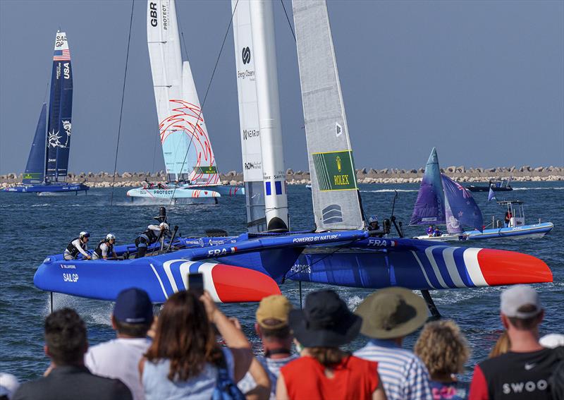 France SailGP Team helmed by Quentin Delapierre in action as spectators watch on from the Race Village on Race Day 1 of the Dubai Sail Grand Prix presented by P&O Marinas in Dubai, United Arab Emirates. 12th November photo copyright Joe Toth for SailGP taken at Dubai Offshore Sailing Club and featuring the F50 class