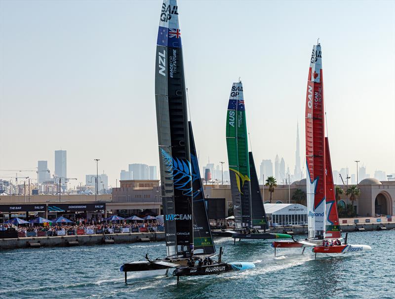 New Zealand SailGP Team, Australia SailGP Team and Canada SailGP Team in action as they sail closely past the Race Village on Race Day 1 of the Dubai Sail Grand Prix  12th November, 2022 Dubai - photo © David Gray/SailGP