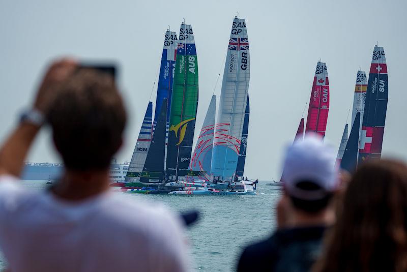 Spectators watch from the Beach Front Fan Zone as the F50 fleet races at the start of the first race on Race Day 1 of the Singapore Sail Grand Prix presented by the Singapore Tourism Board photo copyright Bob Martin for SailGP taken at  and featuring the F50 class