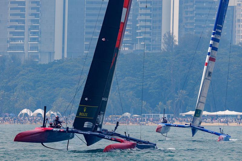 Switzerland SailGP Team helmed by Sebastien Schneiter and France SailGP Team helmed by Quentin Delapierre racing during the first on Race Day 1 of the Singapore Sail Grand Prix presented by the Singapore Tourism Board photo copyright Felix Diemer for SailGP taken at  and featuring the F50 class