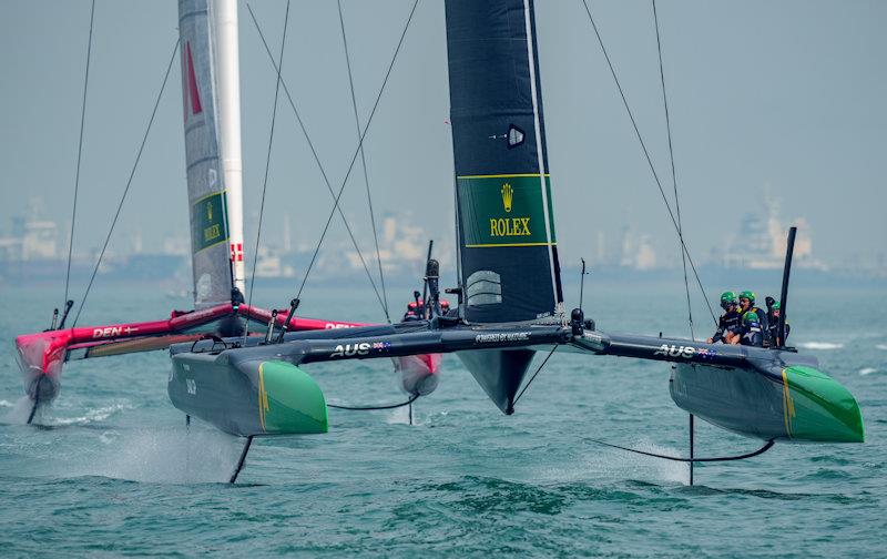 Australia SailGP Team helmed by Tom Slingsby ahead of Denmark SailGP Team presented by ROCKWOOL helmed by Nicolai Sehested on Race Day 1 of the Singapore Sail Grand Prix presented by the Singapore Tourism Board photo copyright Bob Martin for SailGP taken at  and featuring the F50 class