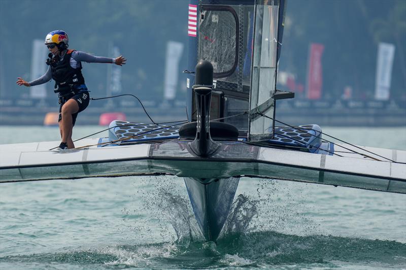 CJ Perez, strategist of USA SailGP Team, runs across the F50 as the USA SailGP Team helmed by Jimmy Spithill racing during the second race on Race Day 1 of the Singapore Sail Grand Prix presented by the Singapore Tourism Board - photo © Eloi Stichelbaut for SailGP