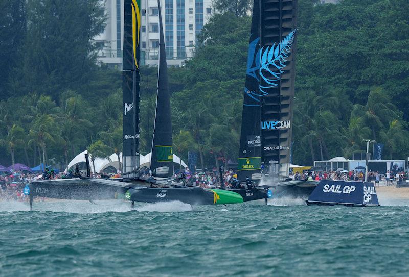 Australia SailGP Team helmed by Tom Slingsby and New Zealand SailGP Team helmed by Peter Burling race towards the SailGP Beach Club and Fan Village on Race Day 2 of the Singapore Sail Grand Prix presented by the Singapore Tourism Board - photo © Eloi Stichelbaut for SailGP