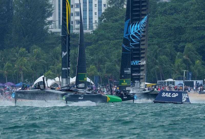 Australia SailGP Team helmed by Tom Slingsby and New Zealand SailGP Team helmed by Peter Burling race towards the SailGP Beach Club and Fan Village on Race Day 2 of the Singapore Sail Grand Prix presented by the Singapore Tourism Board photo copyright Eloi Stichelbaut for SailGP taken at  and featuring the F50 class