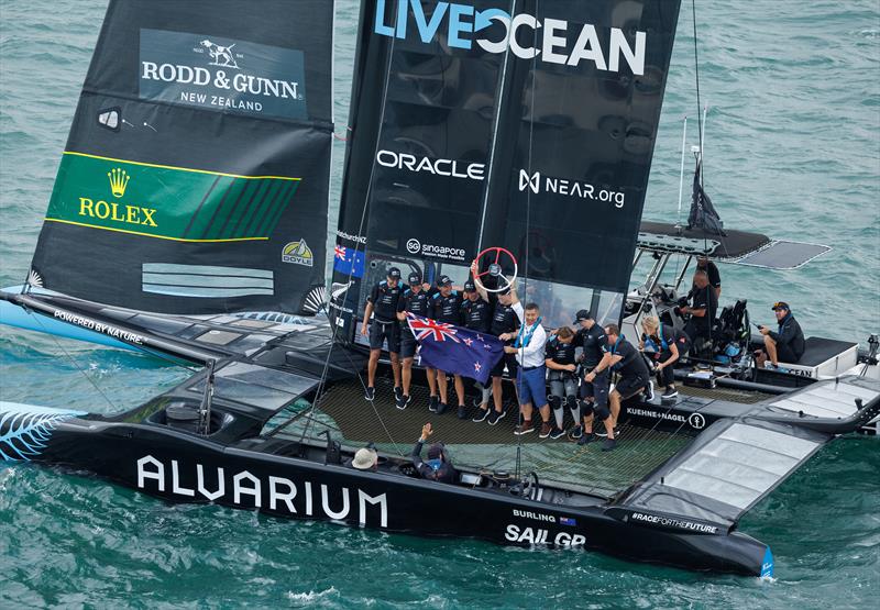 LI Quanhai, President of World Sailing hands the trophy to Peter Burling on board the F50 following their victory in the final race on Race Day 2 of the Singapore Sail Grand Prix  photo copyright Ian Walton/SailGP. taken at  and featuring the F50 class