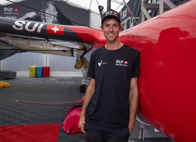 Will Ryan of the Switzerland SailGP Team stands alongside the F50 catamaran in the technical area ahead of the KPMG Australia Sail Grand Prix in Sydney, Australia. Tuesday 14th February - photo © Felix Diemer for SailGP