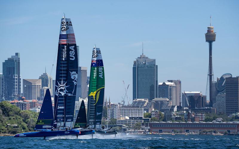 USA SailGP Team helmed by Jimmy Spithill and Australia SailGP Team helmed by Tom Slingsby race side by side in front of the city skyline during a practice session ahead of the KPMG Australia Sail Grand Prix - photo © Bob Martin for SailGP