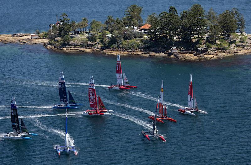 The fleet sail past Genesis Island as they practice a race during a practice session ahead of the KPMG Australia Sail Grand Prix in Sydney, Australia - photo © David Gray for SailGP