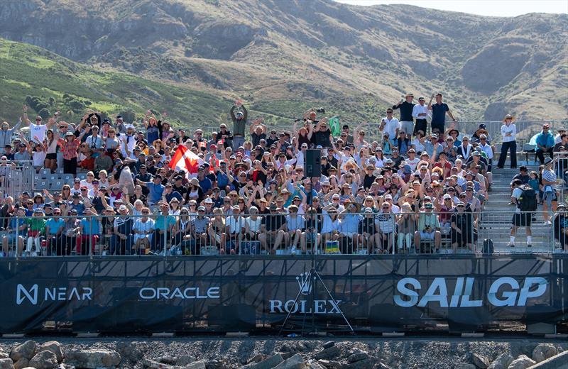 Fans in the grandstand cheer during practise on Race Day 1 of the ITM New Zealand Sail Grand Prix in Christchurch photo copyright Ricardo Pinto/SailGP taken at Naval Point Club Lyttelton and featuring the F50 class