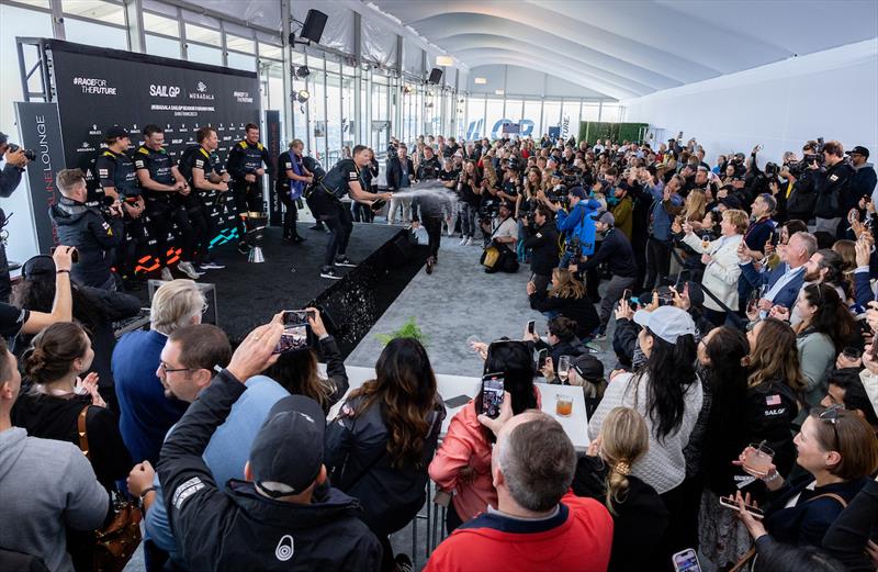 Kyle Langford, wing trimmer of Australia SailGP Team, sprays Barons de Rothschild champagne on stage in the Adrenaline Lounge - Mubadala SailGP Season 3 Grand Final in San Francisco, USA photo copyright Katelyn Mulcahy/SailGP taken at  and featuring the F50 class