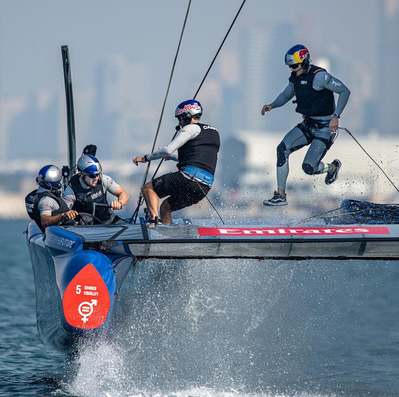 Taylor Canfield and Alex Sinclair run across the boat as as Peter Kinney takes control of the grinding handles during a practice session ahead of the Emirates Sail Grand Prix presented by P&O Marinas in Dubai, United Arab Emirates photo copyright Ricardo Pinto for SailGP taken at  and featuring the F50 class