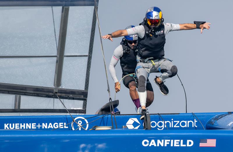 Taylor Canfield, driver of USA SailGP Team, and Victor Diaz de Leon, wing trimmer of USA SailGP Team, runs across the boat on Race Day 1 of the Emirates Sail Grand Prix presented by P&O Marinas in Dubai, United Arab Emirates photo copyright Ricardo Pinto for SailGP taken at  and featuring the F50 class