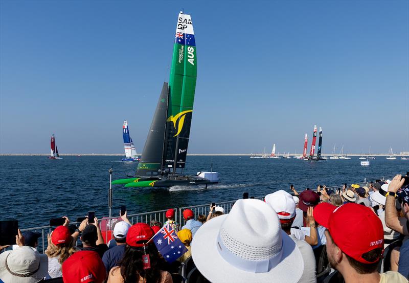 Spectators watch as Australia SailGP Team helmed by interim driver Jimmy Spithill passes the Race Stadium on Race Day 2 of the Emirates Sail Grand Prix presented by P&O Marinas in Dubai, United Arab Emirates photo copyright Kieron Cleeves for SailGP taken at  and featuring the F50 class
