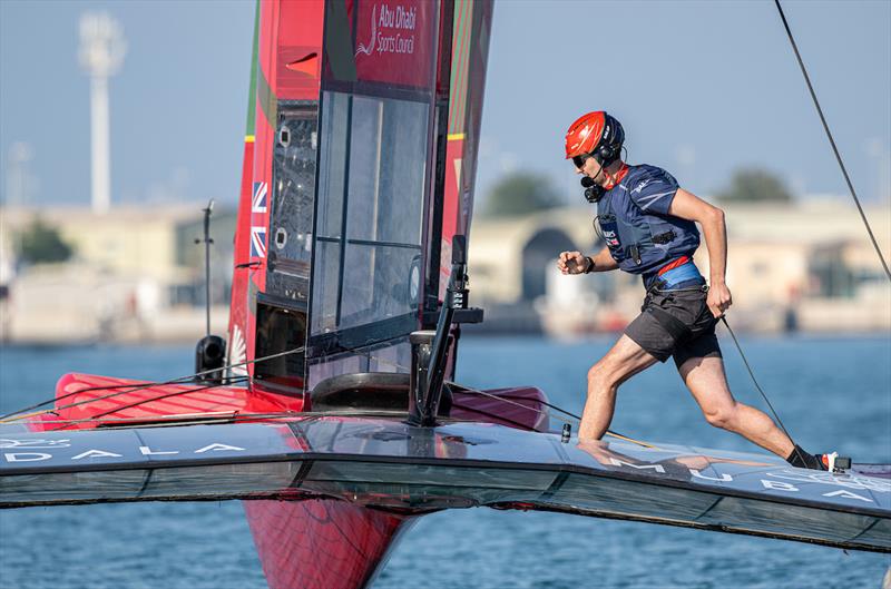 Giles Scott, driver of Emirates Great Britain SailGP Team, runs across the Emirates Great Britain SailGP Team F50 catamaran during a practice session ahead of the Mubadala Abu Dhabi Sail Grand Prix presented by Abu Dhabi Sports Council photo copyright Ricardo Pinto for SailGP taken at  and featuring the F50 class