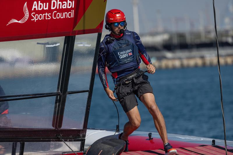Iain Jensen, wing trimmer of Emirates Great Britain SailGP Team, runs across the Emirates Great Britain SailGP Team F50 catamaran during a practice session ahead of the Mubadala Abu Dhabi Sail Grand Prix presented by Abu Dhabi Sports Council photo copyright Felix Diemer for SailGP taken at  and featuring the F50 class