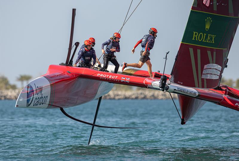 Iain Jensen, wing trimmer, and Hannah Mills, strategist of Emirates Great Britain SailGP Team, cross the boat on Race Day 1 of the Mubadala Abu Dhabi Sail Grand Prix presented by Abu Dhabi Sports Council photo copyright Simon Bruty for SailGP taken at  and featuring the F50 class
