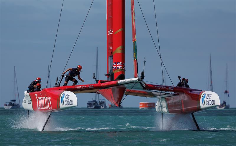 Emirates Great Britain SailGP Team helmed by Giles Scott in action as Neil Hunter, grinder of Emirates Great Britain SailGP Team, crosses the boat during a practice session ahead of racing on Race Day 2 of the ITM New Zealand Sail Grand Prix photo copyright Chloe Knott for SailGP taken at  and featuring the F50 class