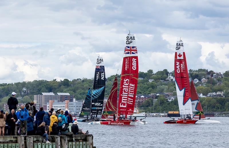 Spectators watch from the shore as Canada SailGP Team, Emirates Great Britain SailGP Team and New Zealand SailGP Team sail past during a practice session ahead of the ROCKWOOL Canada Sail Grand Prix in Halifax, Canada - photo © Katelyn Mulcahy for SailGP