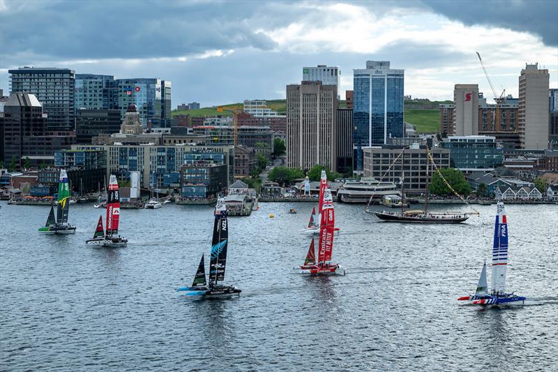 The fleet with New Zealand SailGP Team, ROCKWOOL Denmark SailGP Team and Australia SailGP Team sail past the shoreline on Race Day 1 of the ROCKWOOL Canada Sail Grand Prix in Halifax, Canada photo copyright Ricardo Pinto for SailGP taken at  and featuring the F50 class