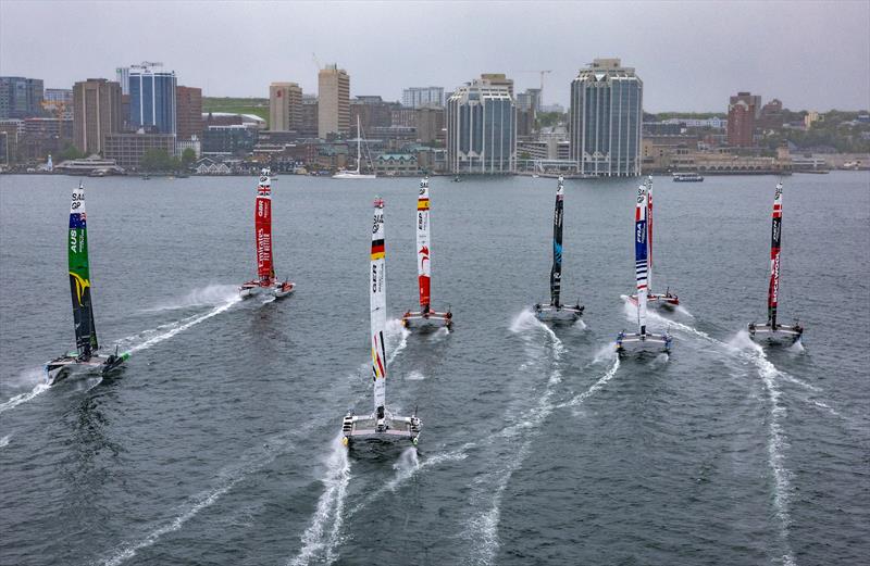 The fleet race towards the skyline in the rain with Emirates Great Britain SailGP Team helmed by Giles Scott leading ahead of Spain SailGP Team, New Zealand SailGP Team, and Canada SailGP Team, on Race Day 2 of the ROCKWOOL Canada Sail Grand Prix - photo © Simon Bruty for SailGP