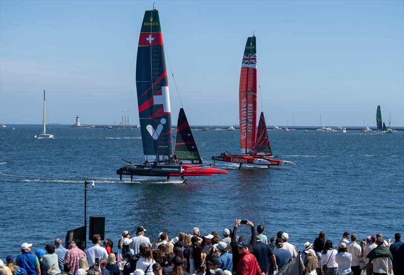 Switzerland SailGP Team helmed by Sebastien Schneiter and Emirates Great Britain SailGP Team helmed by Dylan Fletchergo past the spectators in the SailGP Race Stadium grandstand on Race Day 1 of the Rolex Los Angeles Sail Grand Prix - photo © Andrew Baker for SailGP
