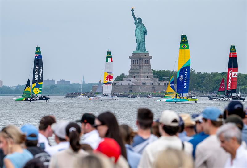 The fleet pass the Statue of Liberty - Day 2 of the Mubadala New York Sail Grand Prix  photo copyright Mike Lawrence/SailGP taken at New York Sailing Club and featuring the F50 class
