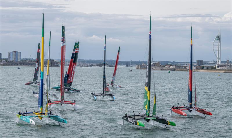 The SailGP F50 catamaran fleet sails away from the Spinnaker Tower and Portsmouth on Race Day 1 of the Emirates Great Britain Sail Grand Prix in Portsmouth, UK - photo © Simon Bruty for SailGP