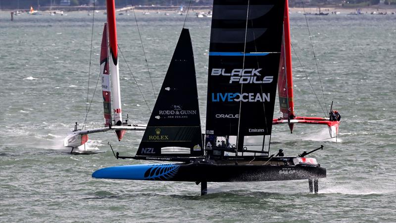 The Black Foils New Zealand SAILGP Team crossing in front of NorthStar SAILGP Team and Emirates Great Britain SAILGP Team on Race Day 2 of the Emirates Great Britain Sail Grand Prix in Portsmouth, UK photo copyright David Maynard / www.alleycatphotographer.com taken at  and featuring the F50 class