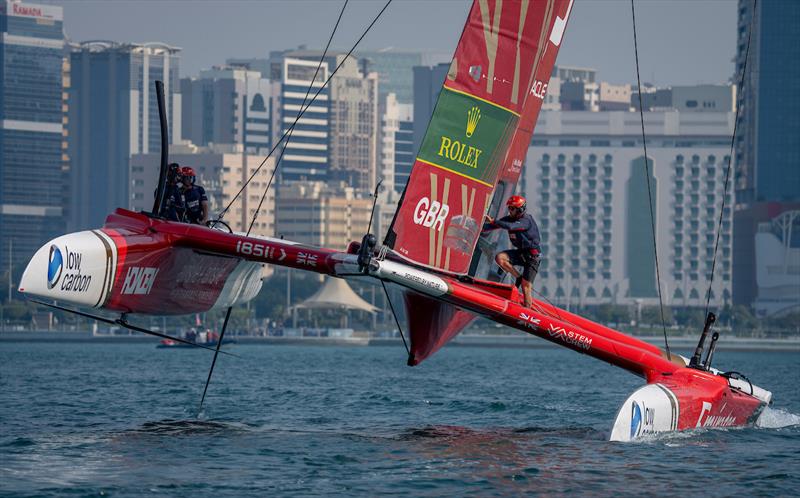 Luke Parkinson, flight controller of Emirates Great Britain SailGP Team crosses the boat whilst in action on Race Day 1 of the Mubadala Abu Dhabi Sail Grand Prix Season Grand Final presented by Abu Dhabi Sports Council - photo © Bob Martin for SailGP