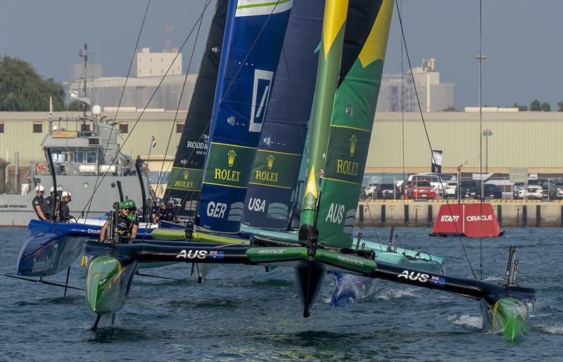 The BONDS Flying Roos SailGP Team helmed by Tom Slingsby lead Germany SailGP Team presented by Deutsche Bank helmed by Erik Heil and the Black Foils SailGP Team on Race Day 1 of the Mubadala Abu Dhabi Sail Grand Prix Season Grand Final  - photo © Ricardo Pinto for SailGP