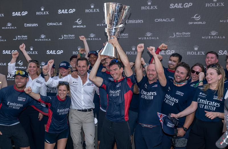 Dylan Fletcher, driver of Emirates Great Britain SailGP Team, lifts the SailGP Championship trophy Race Day 2 of the Mubadala Abu Dhabi Sail Grand Prix Season Grand Final - November 30, 2025 photo copyright Christopher Pike/SailGP taken at Abu Dhabi Sailing & Yacht Club and featuring the F50 class