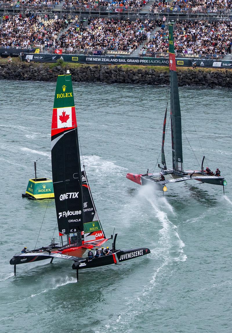 Switzerland SailGP Team helmed by Sebastien Schneiter lead NORTHSTAR SailGP Team helmed by Giles Scott as they sail past the Grandstand, on Race Day 1 of the ITM New Zealand Sail Grand Prix in Auckland, New Zealand - photo © Simon Bruty for SailGP