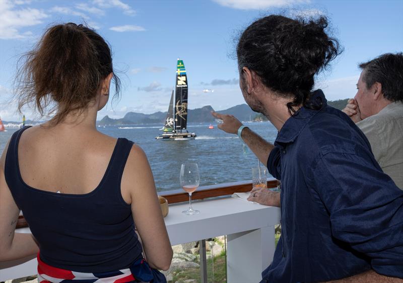 Guests watch Artemis SailGP Team driven by Nathan Outteridge from the Vela Beach Club on Race Day 2 of the ENEL Rio Sail Grand Prix - photo © Katelyn Mulcahy for SailGP