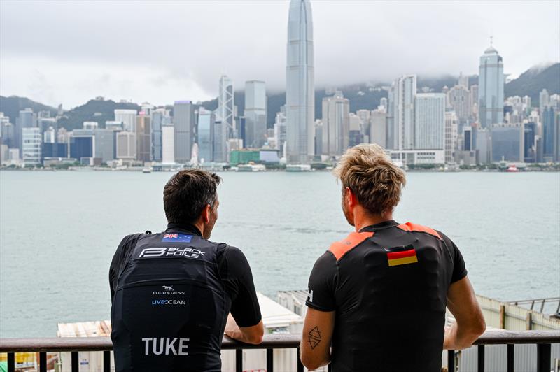 Blair Tuke and Erik Heil looking out at Victoria Harbour in Hong Kong - 2027 Season Venues announcement - SailGP - May 20, 2026 - photo © Keith Tsuji