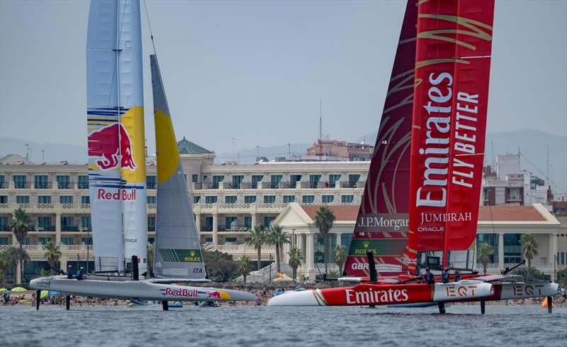 Emirates Great Britain SailGP Team driven by Dylan Fletcher sailing close past Red Bull Italy SailGP Team driven by Phil Robertson during racing on Race Day 2 of the Spain Sail Grand Prix in Valencia, Spain - photo © Ricardo Pinto for SailGP